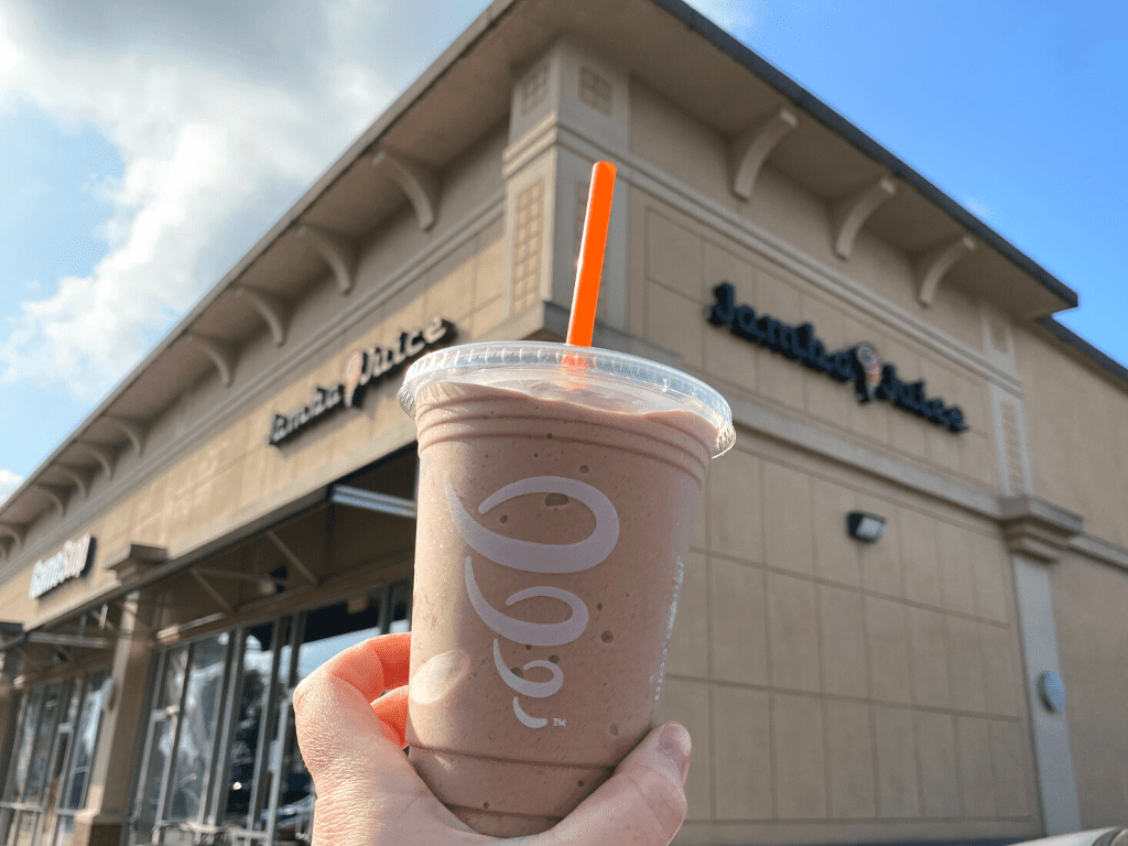 jamba juice smoothie in front of store sign